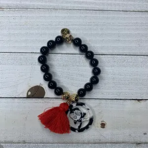 Black Agates with Acetate Skull Medallion and Red Tassel Bracelet 410-14 | Erika Williner Designs